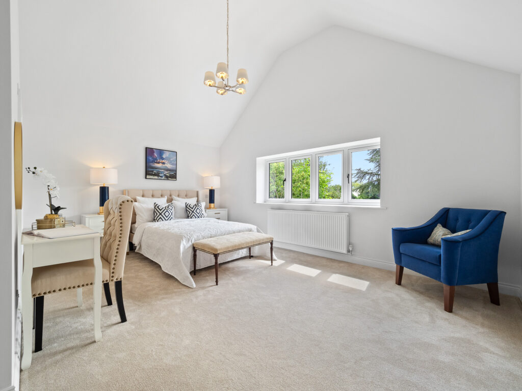 Master bedroom after home staging showing Bed, dressing area and ensuite bathroom. Stratford Warwickshire vacant property for sale